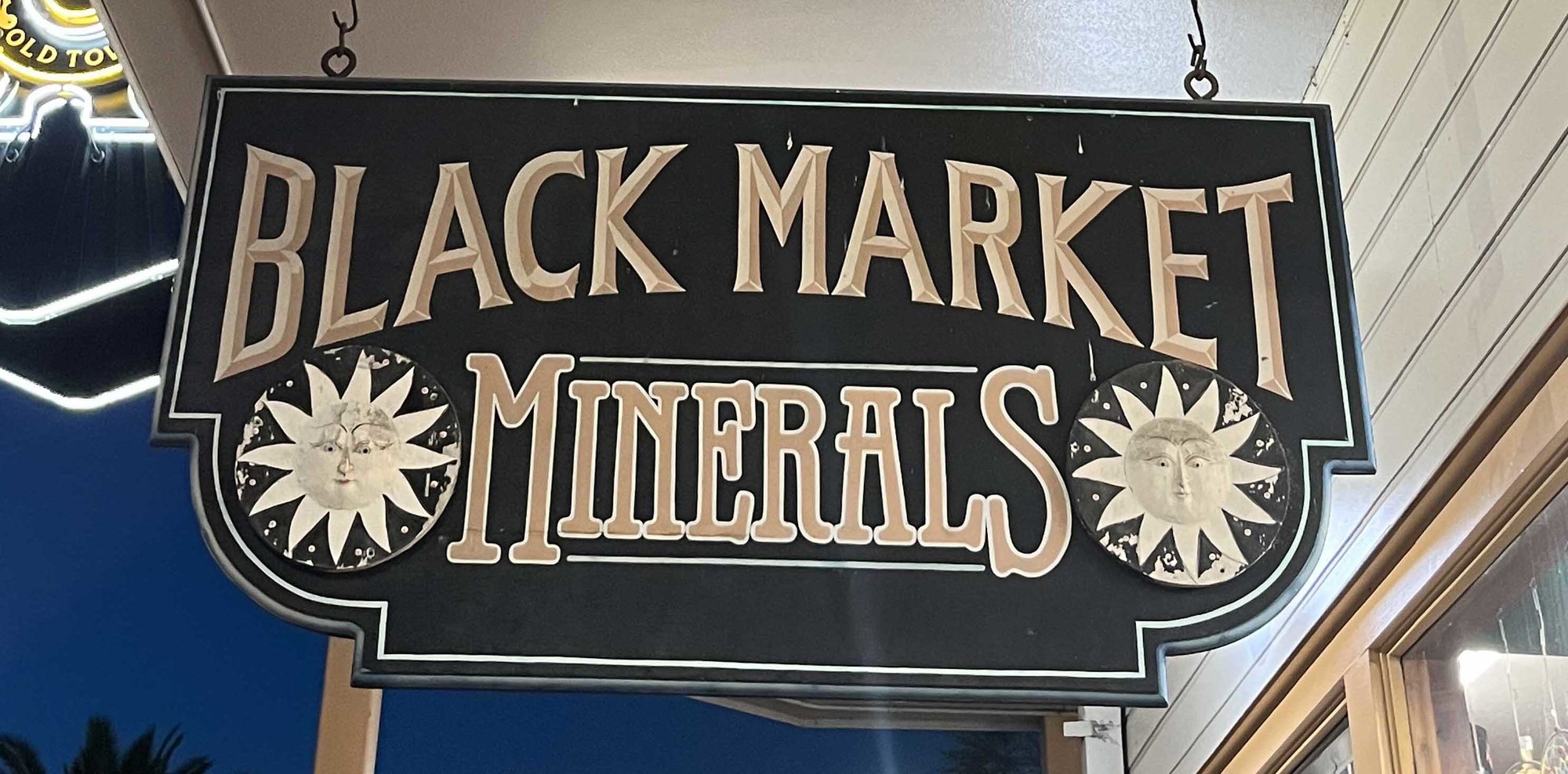black sign that says black market minerals